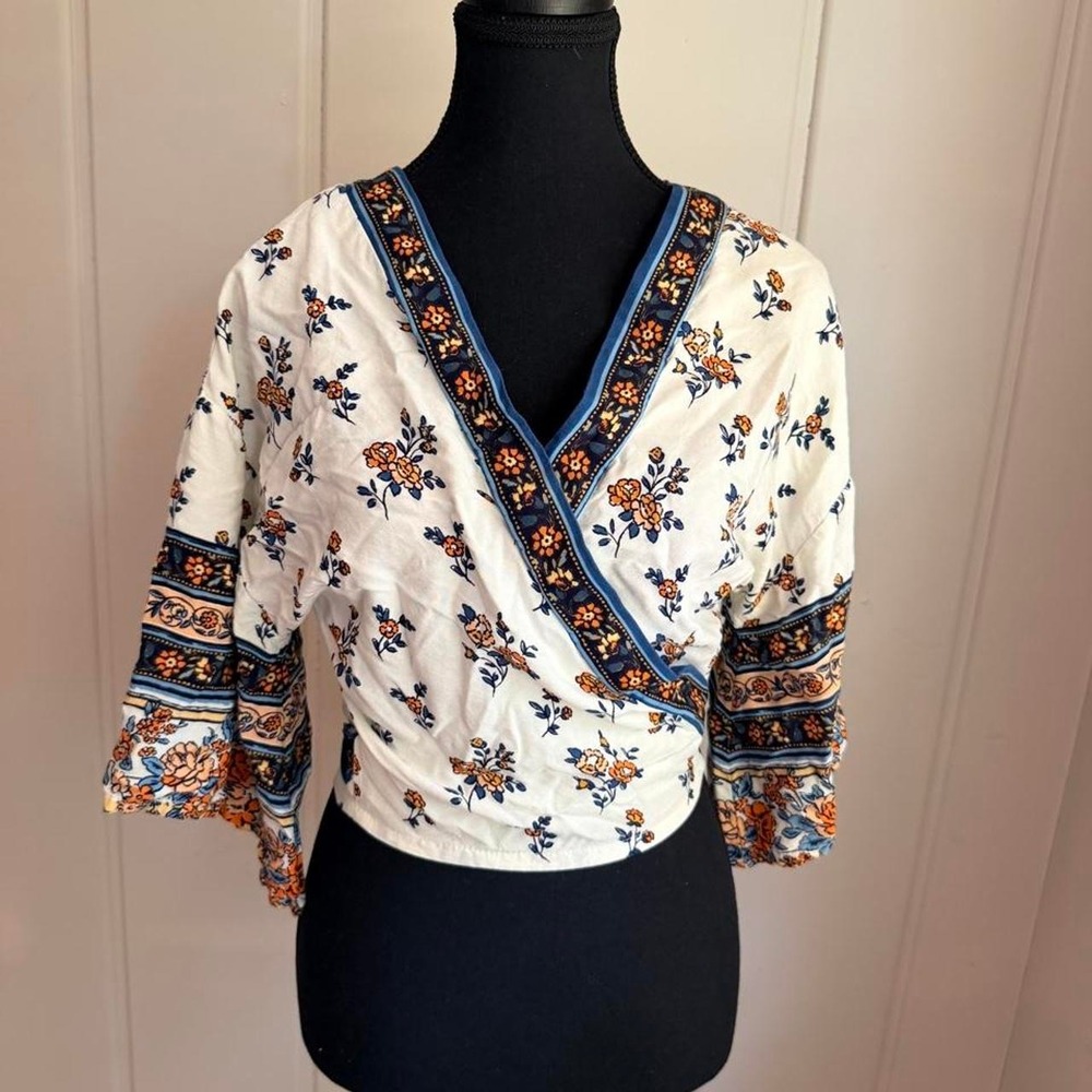 Japna floral wrap top with bell sleeves. Size: XS